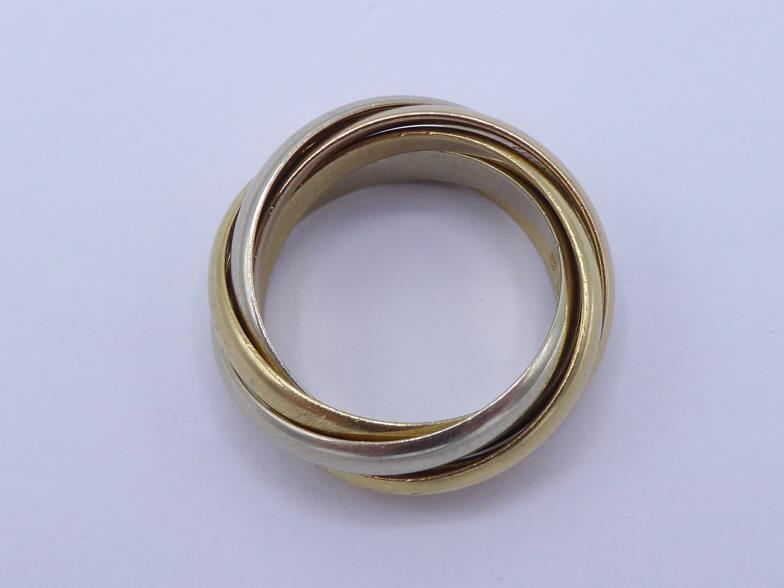 CARTIER, 'must de Cartier', an 18 carat three colour gold five band 'Trinity' ring, French poincon - Image 2 of 3