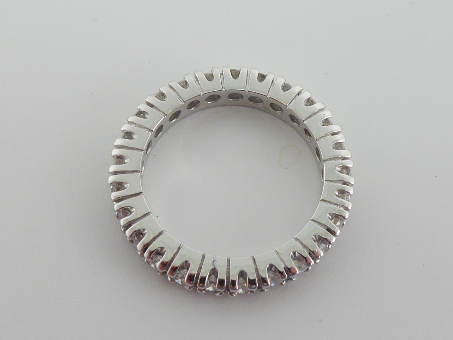 A diamond eternity ring, the band of brilliants totalling approx. 0.75 carat, the white mount - Image 2 of 2