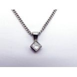 A single stone diamond pendant, the rub over set princess cut approx. 0.15 carat, mounted in 18 cart