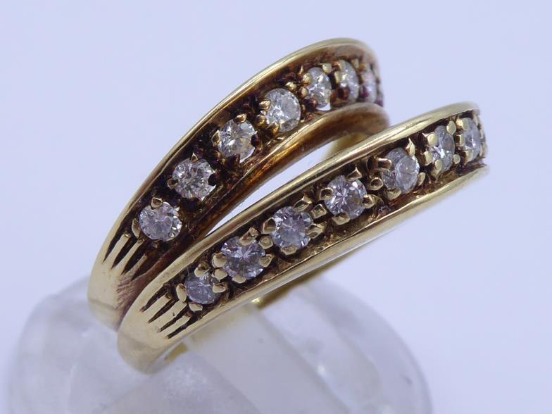 A mid 20th century diamond ring, composed of bifurcated bands, each pave set with a line of - Image 3 of 5