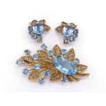 BOUCHERON, an 18 carat gold and aquamarine brooch and earring suite, circa 1950, the floral spray