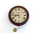 A mahogany cased 12inch wall clock with 8 day fusee movement by Camerer Cuss, the white dial with