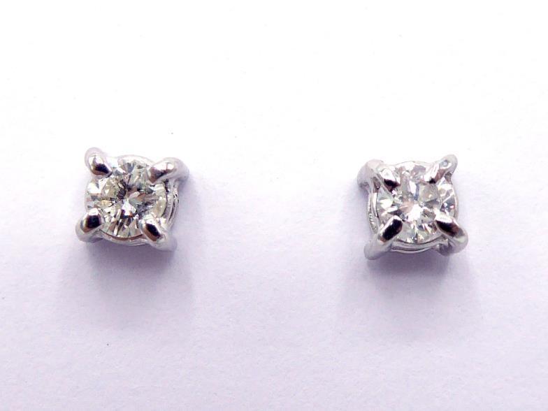 A pair of 9 carat gold and single stone diamond ear studs, each round cut brilliant approx. 0.20