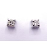 A pair of 9 carat gold and single stone diamond ear studs, each round cut brilliant approx. 0.20