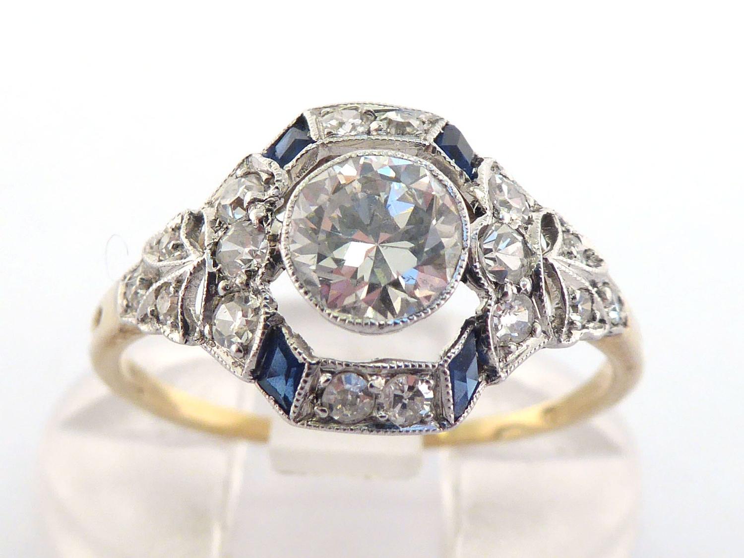 An Art Deco sapphire and diamond ring, circa 1920, the central millgrain set brilliant approx. 0.