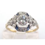 An Art Deco sapphire and diamond ring, circa 1920, the central millgrain set brilliant approx. 0.