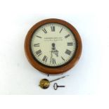 An oak cased 12 inch wall clock with 8 day fusee movement by Camerer Cuss, the white dial with Roman