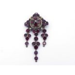 A 19th century Austro-Hungarian garnet brooch, the circular top set with a quatrefoil of oval