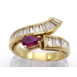 A ruby and diamond dress ring, the cross over bezel channel set with baguette cut diamonds,