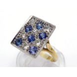 An 18 carat gold, sapphire and diamond plaque ring, composed of a rectangular checker board of