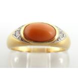 Van Cleef & Arpels, an 18 carat gold, coral and diamond ring, the coral cabochon 8 x 5mm,