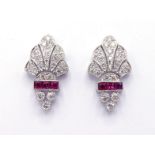 A pair of 18 carat white gold, diamond and ruby earrings, millgrain set across the geometric Art