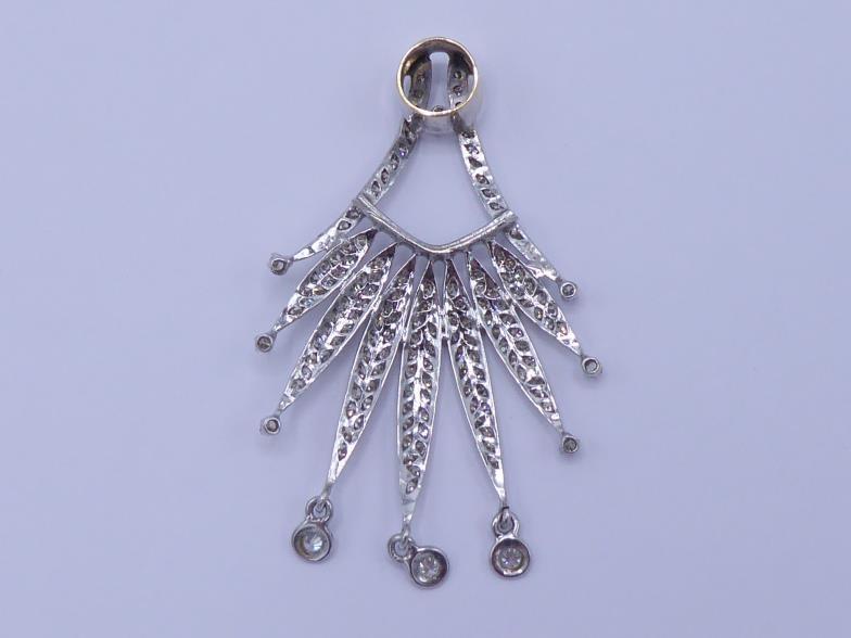 A diamond pendant, of spray design, pave set overall with small brilliants, three spectacle set - Image 2 of 2