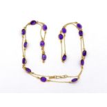 An amethyst line necklace, composed of uniform spectacle set oval amethysts, each 7mm long, with