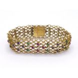 A French 18 carat gold, ruby, sapphire, emerald and diamond bracelet, composed of mesh links set