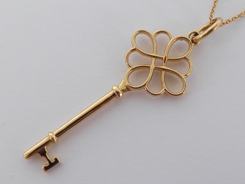 TIFFANY & Co., an 18 carat gold key pendant, signed and hallmarked, 4.5cm long, together with 18 - Image 5 of 5