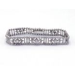 An Art Deco diamond line bracelet, centring on a row of gently graduating old brilliant cuts,