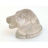 A large rock crystal carving of a hound's head with bared teeth and long ears. 12x6x8cm. high.