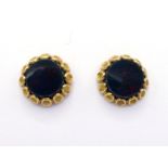 A pair of yellow metal (tests 18 carat gold) and bloodstone ear studs, the circular bloodstone discs