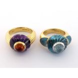 A pair of 18 carat gold and gem set interchangeable dress rings, each composed of a carved gem