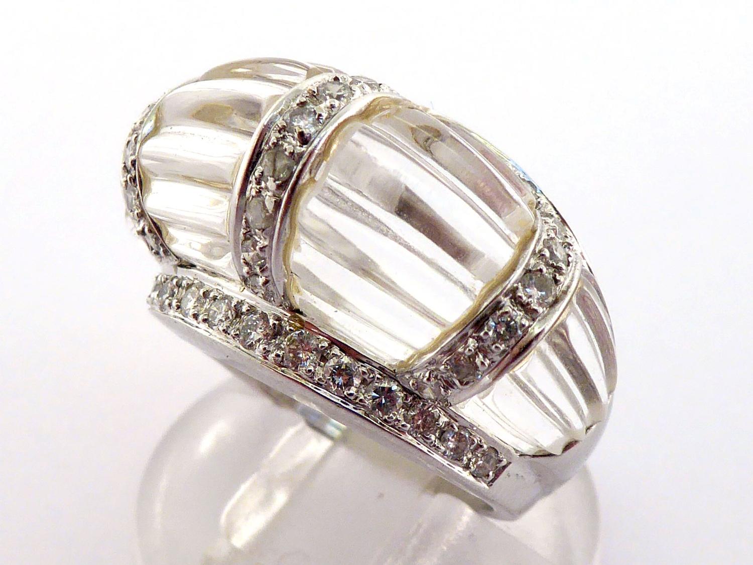 A rock crystal and diamond dress ring, the bombe bezel composed of segments of fluted rock crystal