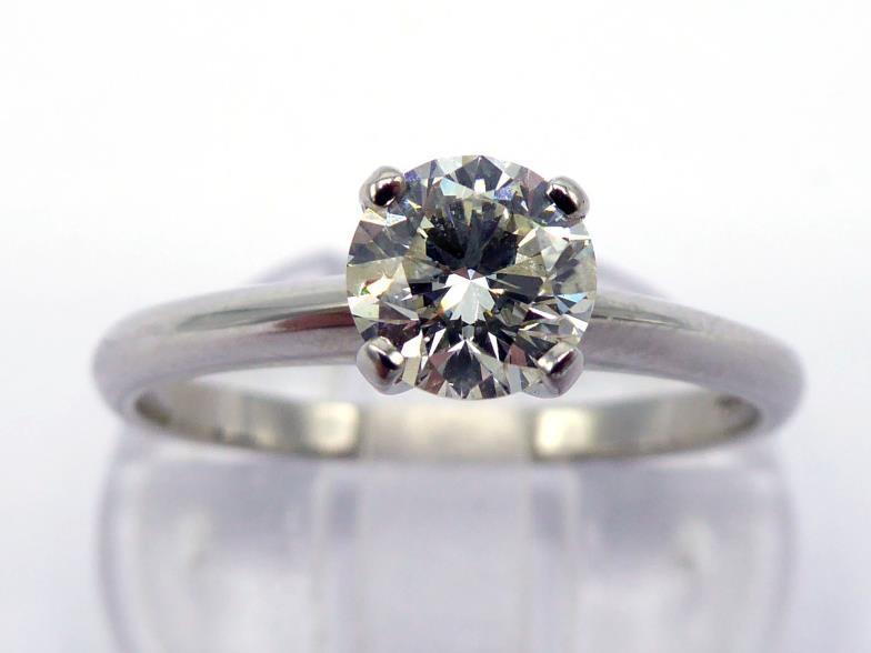 A platinum and single stone diamond ring, the round cut brilliant approx. 0.67 carat, the shank