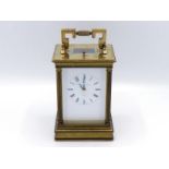 A modern gilt brass cased carriage clock by Matthew Norman with eight day hour and half hour