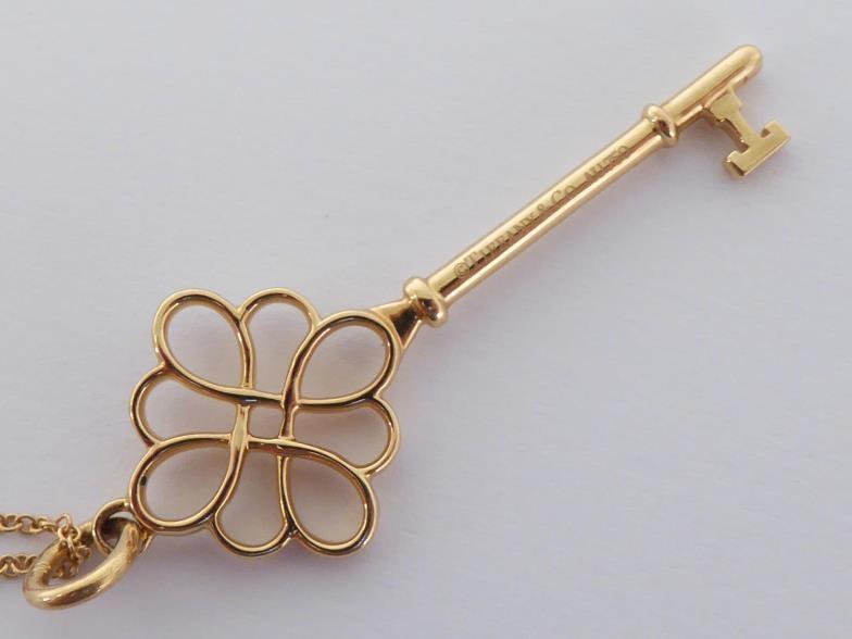 TIFFANY & Co., an 18 carat gold key pendant, signed and hallmarked, 4.5cm long, together with 18 - Image 4 of 5