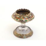 An Austrian carved rock crystal and champleve enamelled cup, the rock crystal foot and stem carved