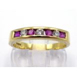 An 18 carat gold, ruby and diamond band ring, channel set with alternate small brilliants and