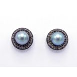 A pair of cultured pearl and diamond ear studs, the grey pearls 8.6mm, in a two row surround of