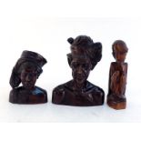 Three Indonesian hardwood carvings comprising:-two busts, a man and a woman with headscarves and a