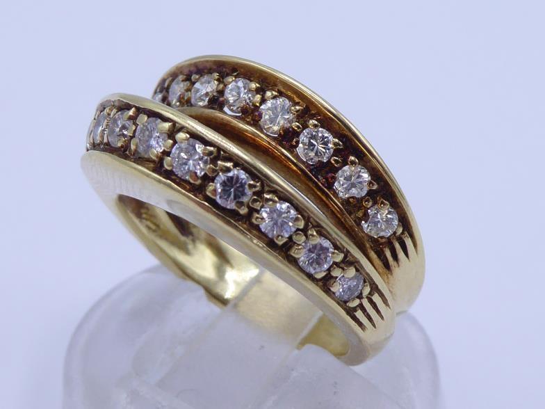 A mid 20th century diamond ring, composed of bifurcated bands, each pave set with a line of - Image 2 of 5