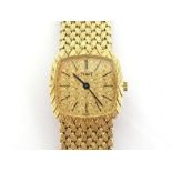 PIAGET, a lady's 18 carat gold manual wind wristwatch, the textured square cushion dial with black