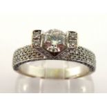 A diamond dress ring, the central brilliant approx. 0.50 carat, tension set in a V prong setting