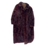 A three quarter length brown fur coat size large.