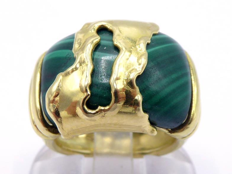 An Italian 18 carat gold and malachite ring, set to the centre with a convex section of malachite,