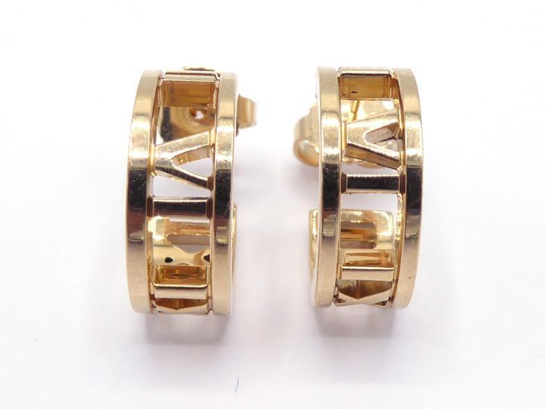 TIFFANY & Co., 'Atlas', a pair of 18 carat gold earrings, the hoops 14mm diameter, signed and