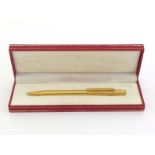 CARTIER, Must de Cartier, a gold plated pencil, with its box, retains lead