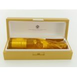 A bottle of Louis Roederer 2009 Cristal Brut champagne in original wrap and golden presentation