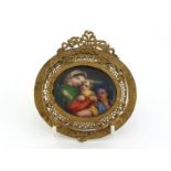 A 19th. century Continental miniature ceramic oval plaque of a classical group of a mother and two