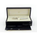 WITHDRAWN DUNHILL, a faceted silver 'Torpedo' limited edition ballpoint pen with clock, no. 89/350,