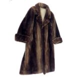 A three quarter length beaver lamb brown fur coat, size large.