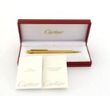 CARTIER, Must de Cartier, a gold plated pencil, with its box, retains lead