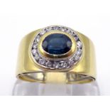 An Italian 18 carat gold, sapphire and diamond ring, the central rub over set oval cut sapphire 5.