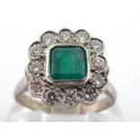 An emerald and diamond cluster ring, the central square cut emerald 5 x 5mm, in a surround of