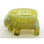 A rare Victorian flower vase in opalescent pressed glass formed as a caparisoned elephant bearing an
