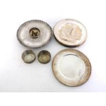 A quantity of silver-plated items comprising:- a set of eight large circular platters struck with