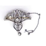 A late 19th century Belle Epoche diamond brooch/pendant, the winged open work motif set overall with