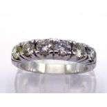 A diamond dress ring, set with a band of six uniform brilliants totalling approx. 0.90 carat, the